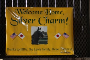 The sign in one of the barns welcoming him back