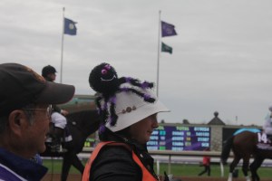 A photographer in the Halloween spirit walks by